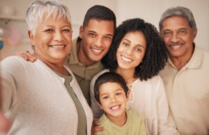 Multi-generational family standing together outdoors representing family-friendly healthcare at Forest Lake Family Practice